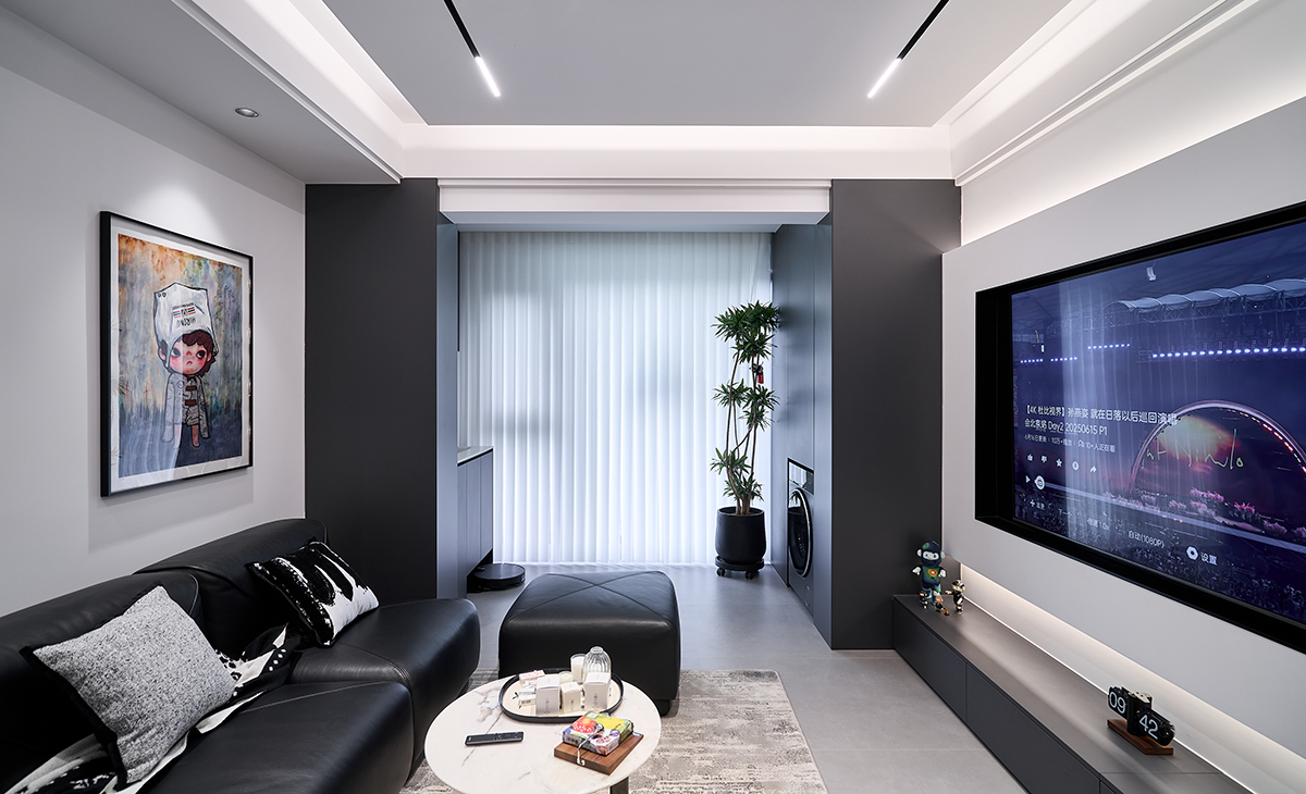 以 “冷靜秩序感 + 生活松弛感” 為核心，采用深灰 / 黑色啞光材質(zhì)為基底，融入藝術(shù)軟裝與功能細(xì)節(jié)，打造適配都市年輕群體的 “質(zhì)感型社交客廳”。